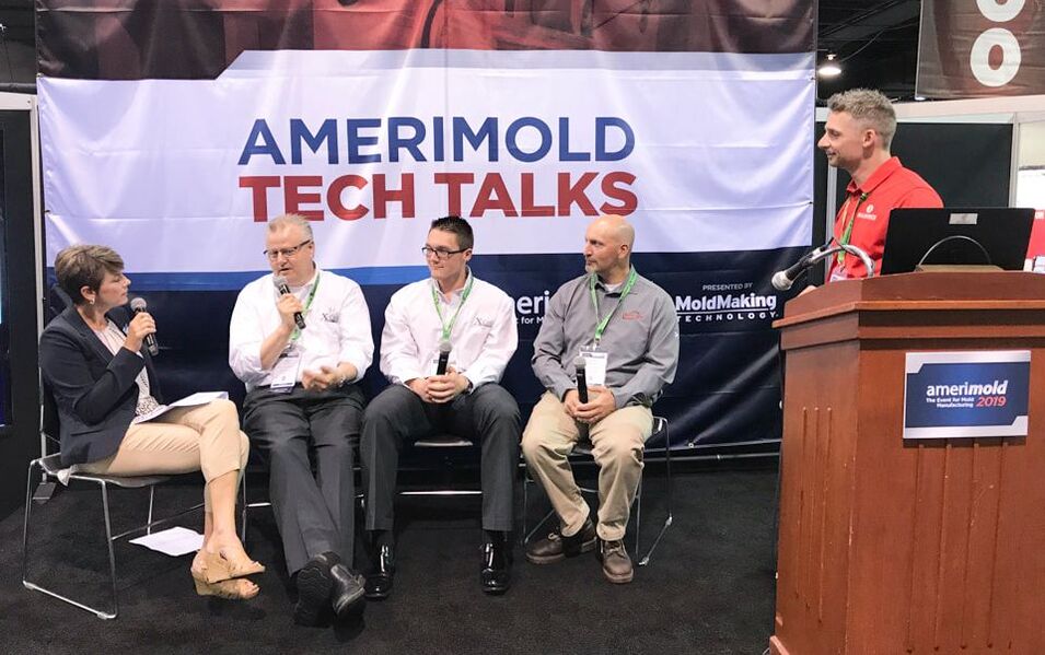 Man and woman are talking in amerimold tech talks